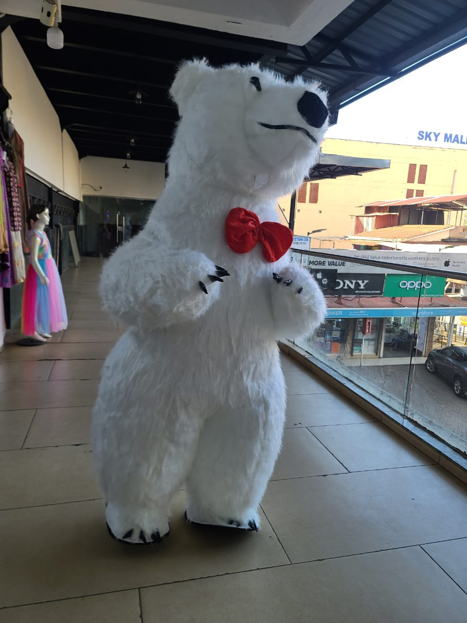 Inflatable Polar Bear Mascot Costume with Plush Fur & Red Bow Tie – Event Promotion Costume